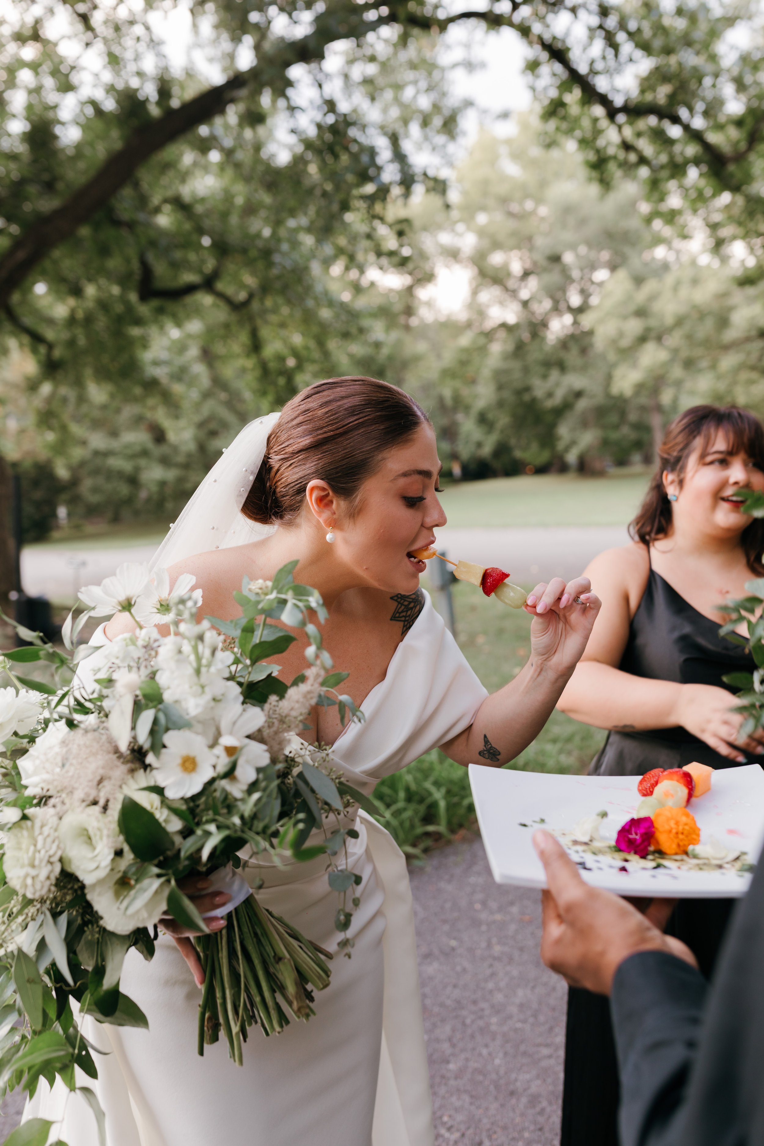 Bride enjoying appetizers on the grounds