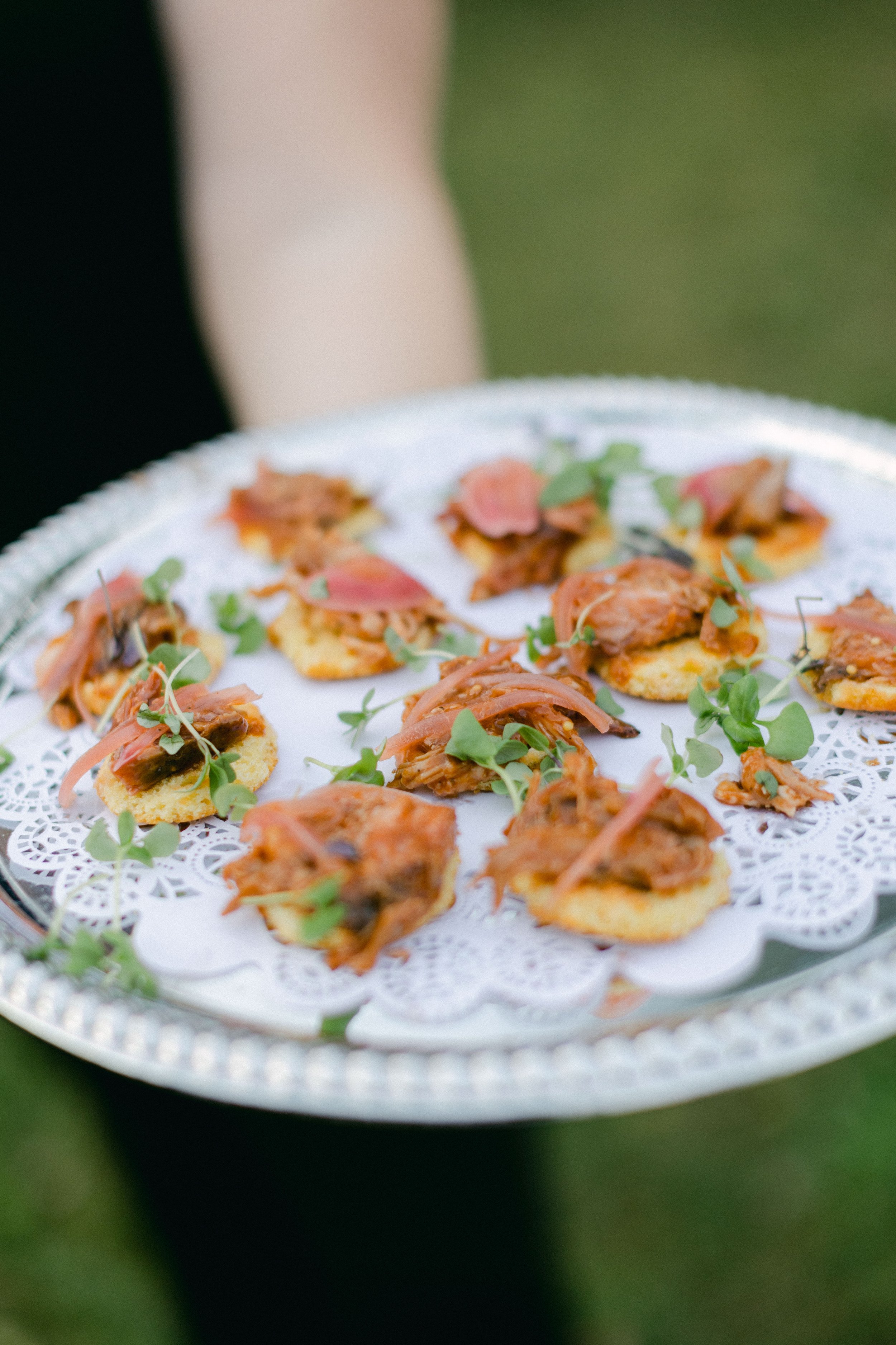 Couple and wedding party on the Peterson-Dumesnil House veranda during evening event