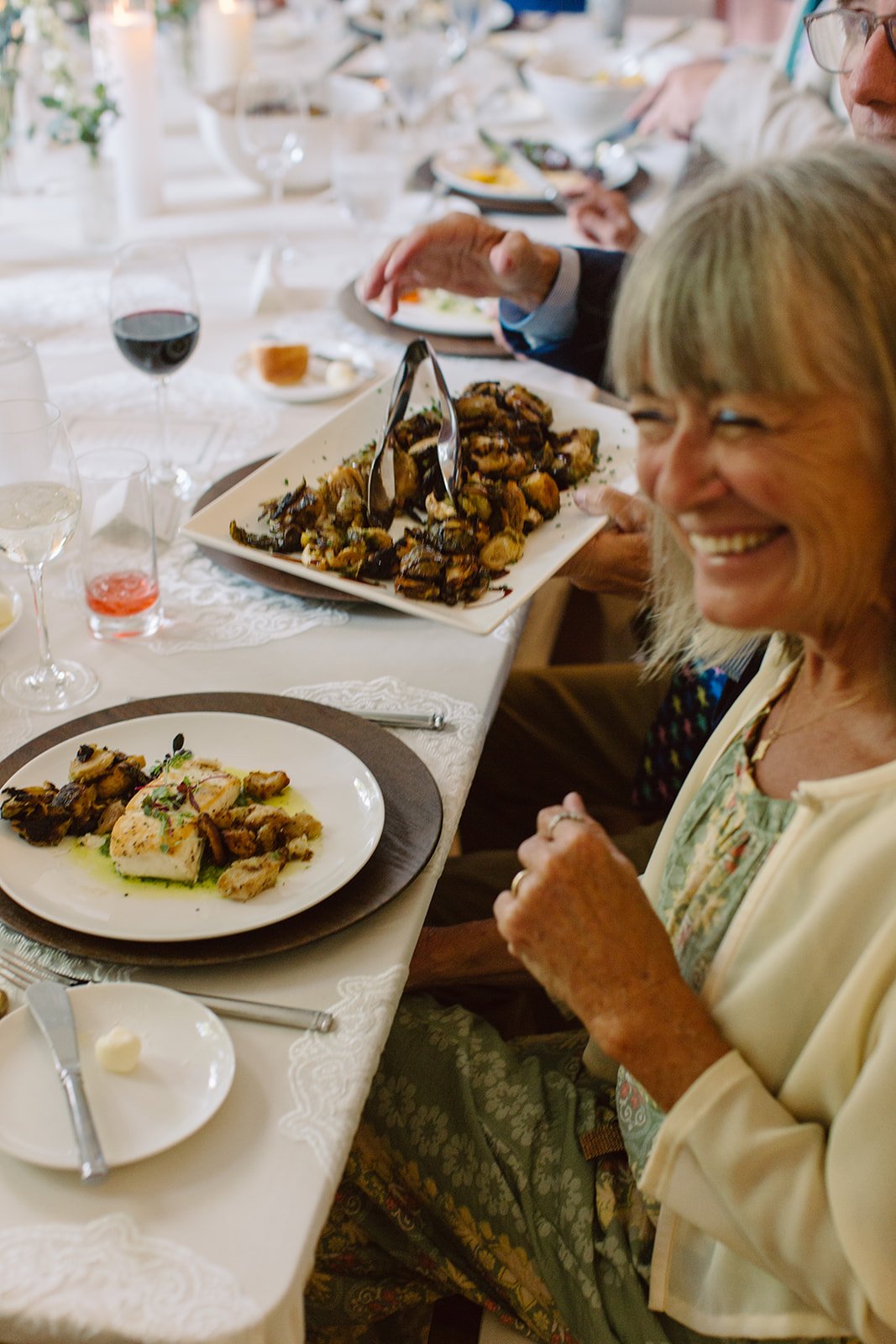 Guests gathered on the grounds of Peterson-Dumesnil House during a garden wedding reception